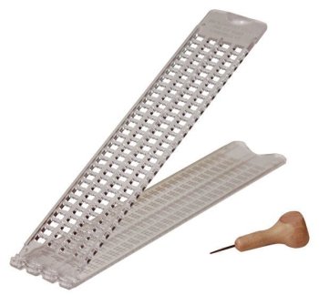 Picture of a 4 line slate and stylus for braille writing and reading.