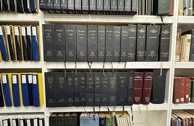 Picture of a row of hard cover braille books titled Greek New Testament