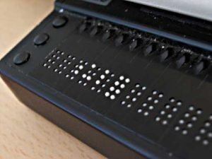 Up close picture of the dots on a refreshable braille device.